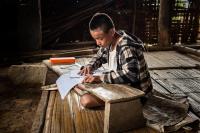 Naga Youth Doing His Homework, Myanmar