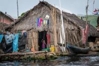 In Panama, the Kuna Yala peoples are already experiencing the impacts of the raising sea level due to climate change . Their and homes are often flooded.