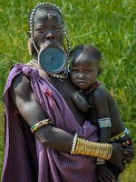 Mursi tribe:   See more in the book: http://www.blurb.com/b/4633120-people-of-the-omo-valley-under-climate-and-other-p