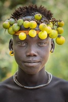 Mursi tribe:   See more in the book: http://www.blurb.com/b/4633120-people-of-the-omo-valley-under-climate-and-other-p
