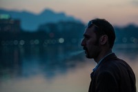 Man Smoking a Cigarette by the Zyandé-Rud River, Iran, Iran