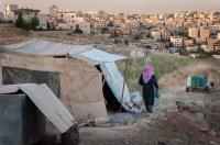 Some Jordanian Bedouins camp around the capital, Amman. They collect their drinking water and water for other use in buckets due to water scarcity.