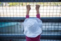 Afghani refugee child in the old airport in Athens, Greece