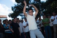 Syrian refugee dance in the makeshift camp in the square next to the train station in Belgrade, Serbia.