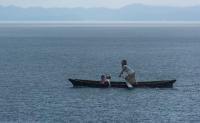 Moken Girl Rowing in the Rain, Myanmar