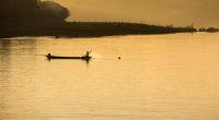 Fisherman on the Chindwin River in the Early Morning Sun, Myanmar